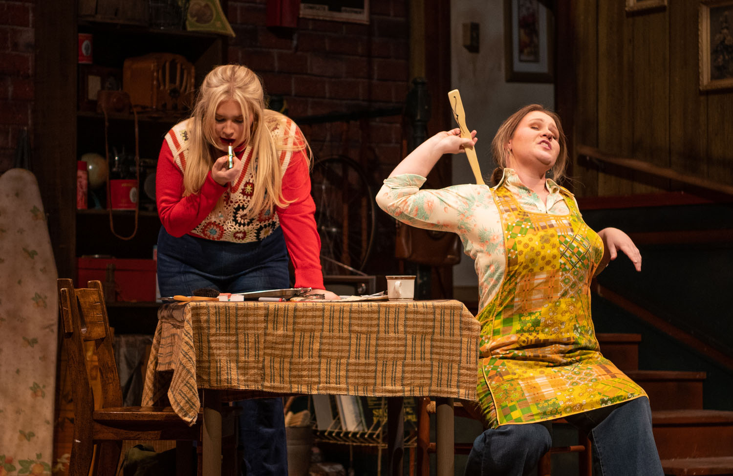 Two women on stage rehearsing play